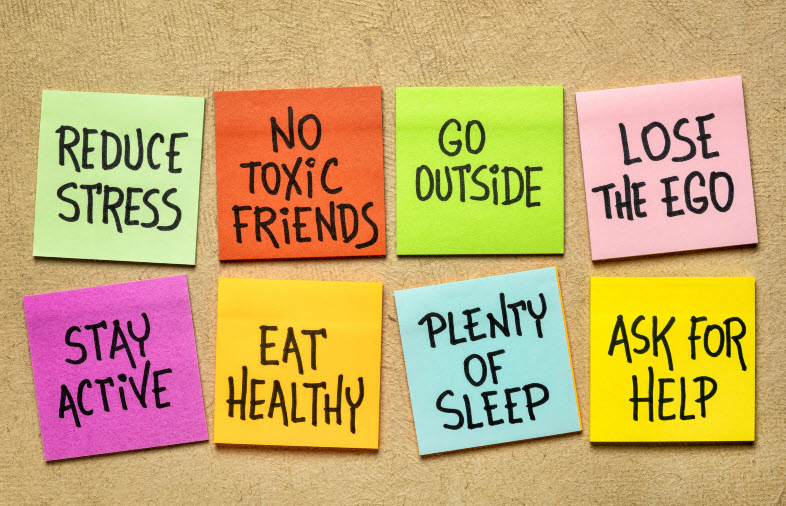 A collection of colorful sticky notes with positive messages such as 'Reduce stress,' 'No toxic friends,' and 'Go outside,' promoting healthy habits.