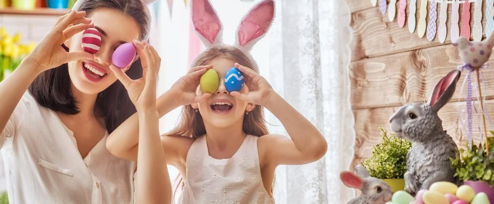 A joyful family celebrating Easter with dyed eggs and bunny ears, reflecting the light-hearted, consumer-focused version of the holiday, in contrast to its religious origins.